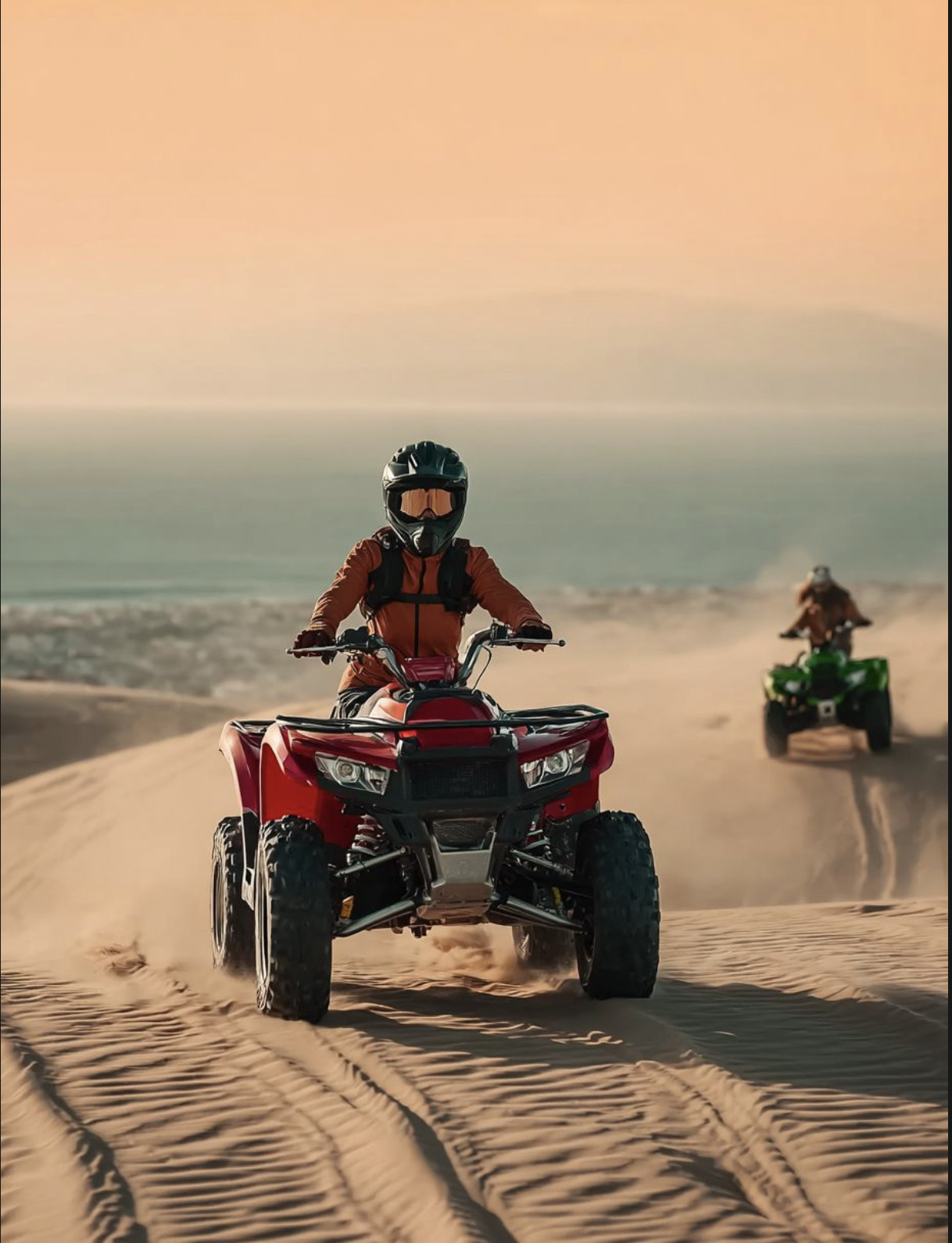 A man riding a red dirt bike.